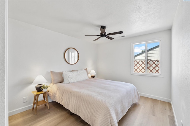 2008 Tinkle St, Richland, WA 99352 - bedroom featuring light wood-type flooring, baseboards, and ceiling fan