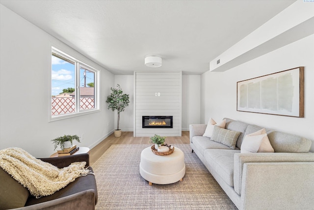 2008 Tinkle St, Richland, WA 99352 - living area featuring a fireplace, wood finished floors, and baseboards