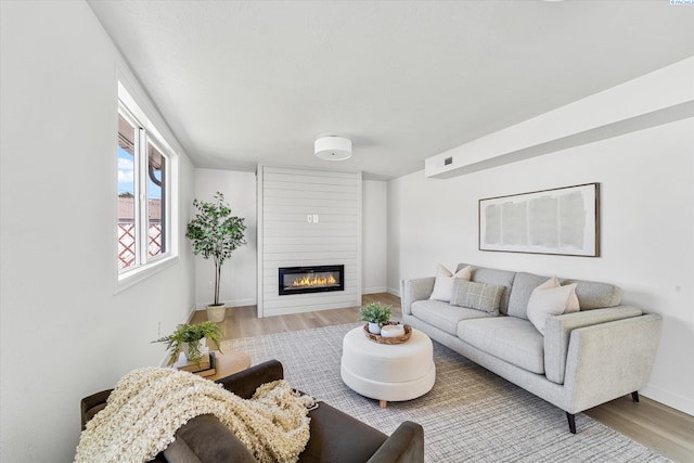 2008 Tinkle St, Richland, WA 99352 - living room featuring wood finished floors, a large fireplace, and baseboards