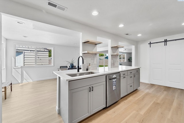 2008 Tinkle St, Richland, WA 99352 - kitchen with a sink, stainless steel dishwasher, gray cabinets, light wood-type flooring, and recessed lighting
