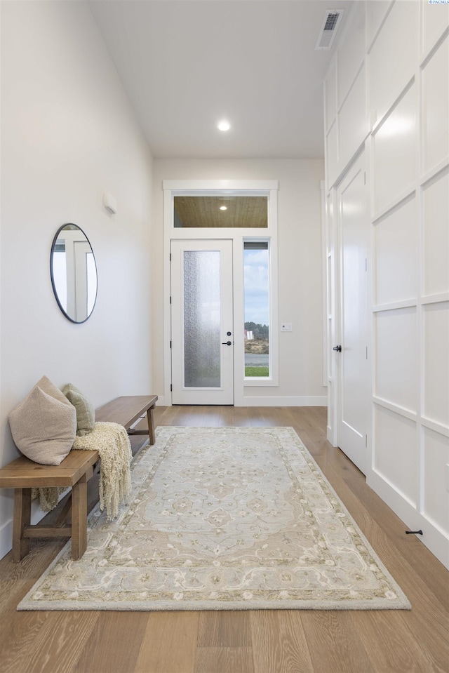 foyer entrance with light hardwood / wood-style flooring