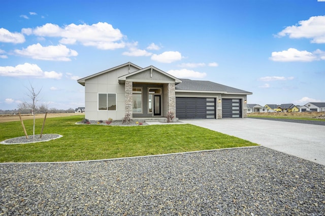 view of front facade with a garage and a front yard