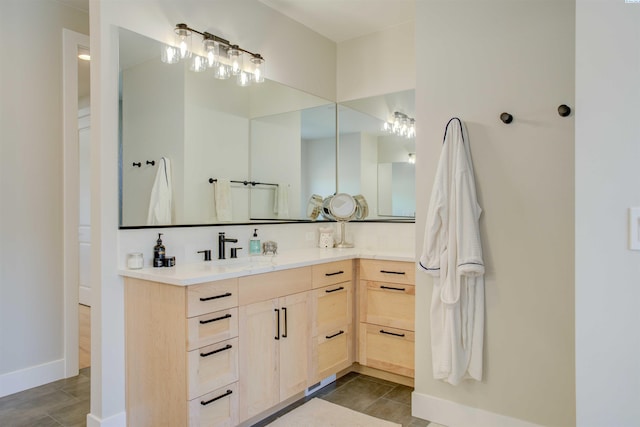 bathroom with tile patterned floors and vanity