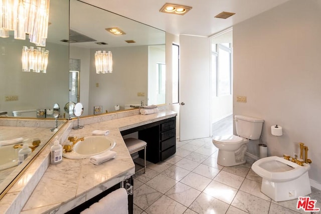 bathroom featuring tile floors, toilet, vanity, and a bidet