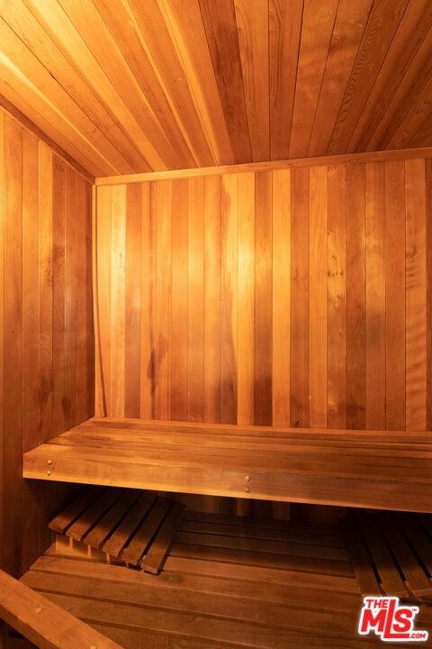 view of sauna / steam room with wooden ceiling and wood-type flooring