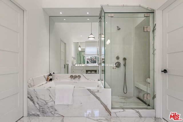 bathroom featuring plus walk in shower, tile floors, and large vanity