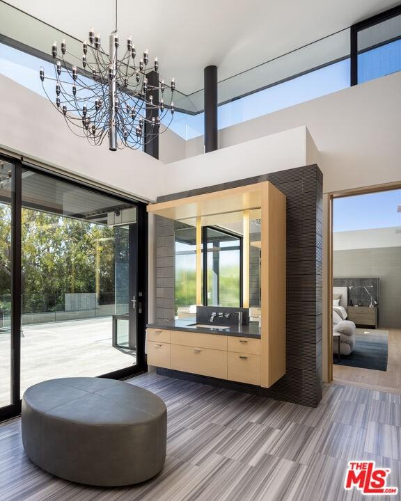 interior space with an inviting chandelier and wood-type flooring