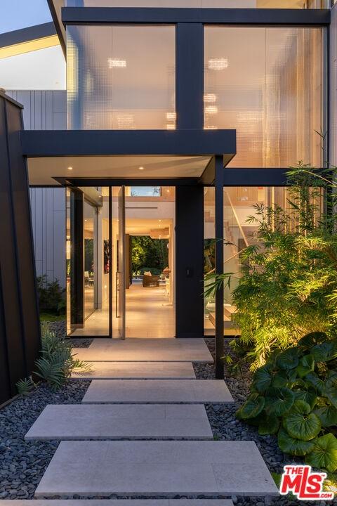 doorway to property with a patio