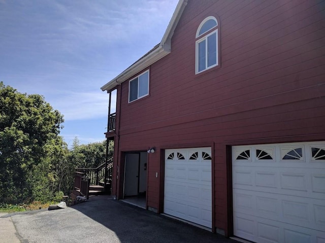 view of property exterior featuring a garage