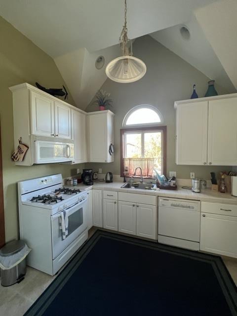 kitchen with white appliances, white cabinetry, sink, and pendant lighting