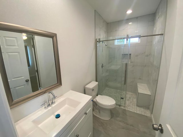 bathroom with vanity, tile flooring, a shower with shower door, and toilet