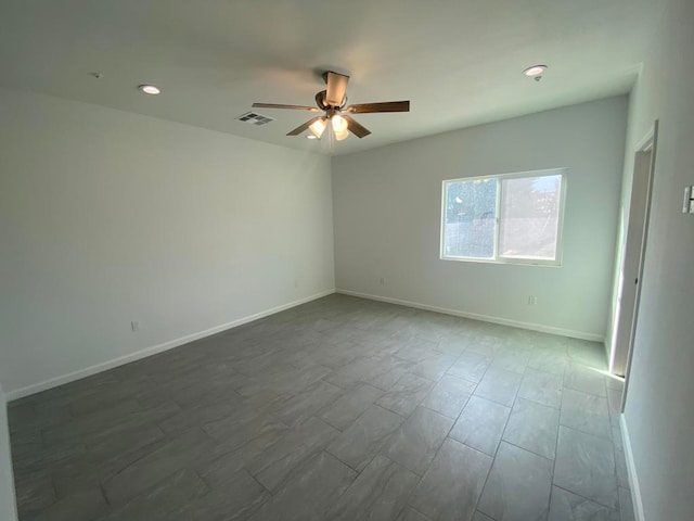 unfurnished room with ceiling fan