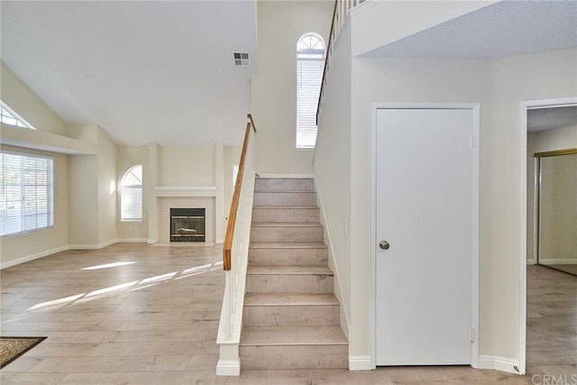 stairs featuring light hardwood / wood-style flooring