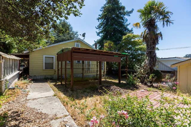 rear view of house with a carport