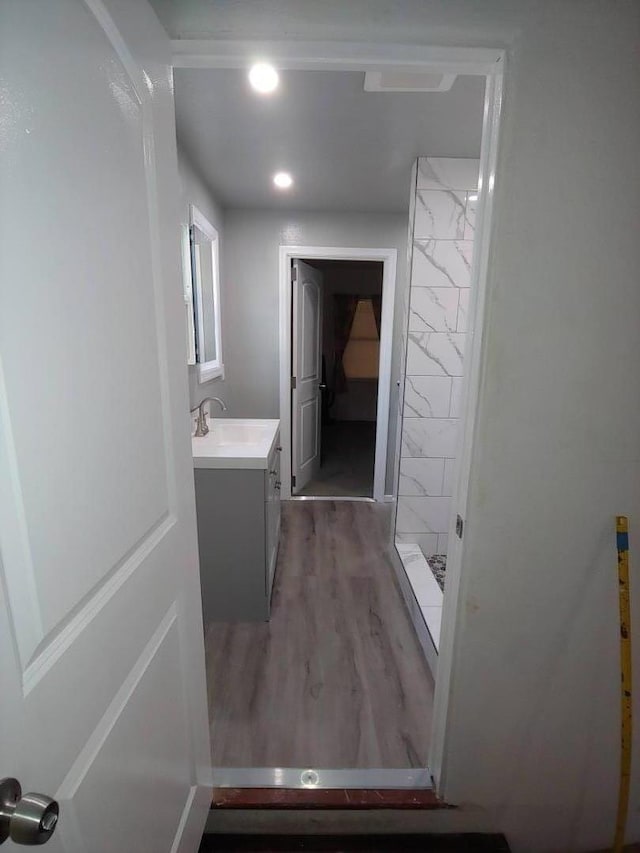 hall with dark hardwood / wood-style floors and sink