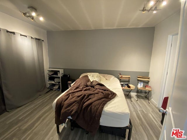 bedroom featuring hardwood / wood-style flooring