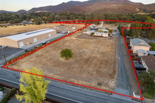 birds eye view of property featuring a mountain view