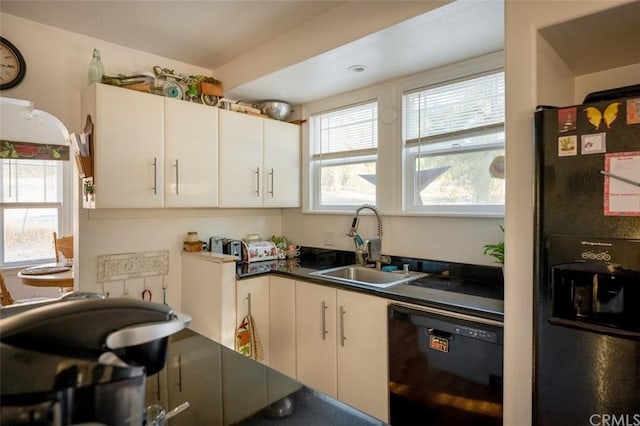 kitchen with sink, black fridge with ice dispenser, dishwasher, and a healthy amount of sunlight