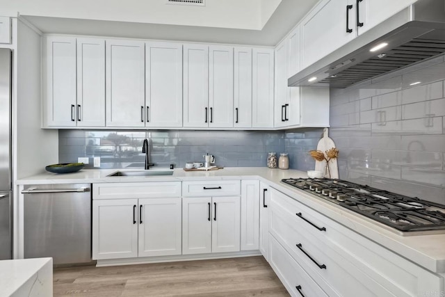 kitchen featuring backsplash and light hardwood / wood-style flooring