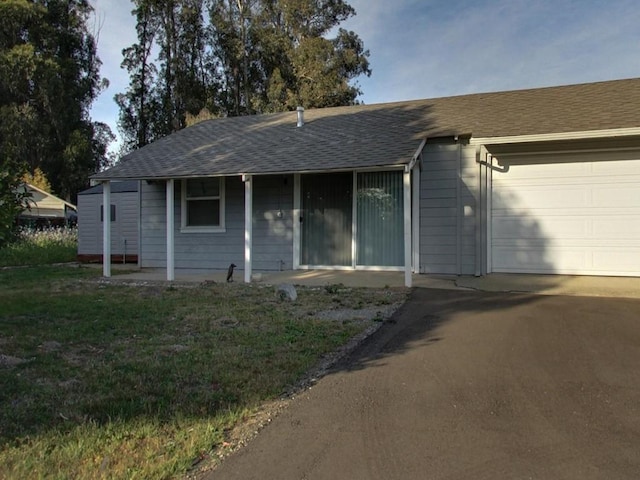 single story home featuring a garage