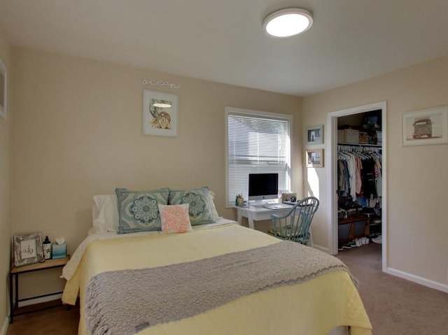 carpeted bedroom featuring a closet and a spacious closet