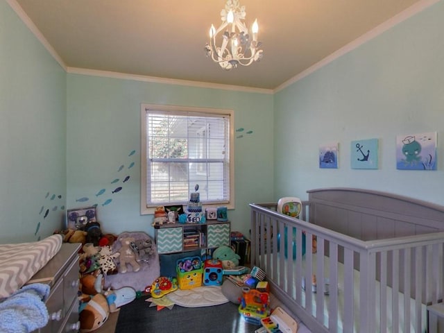 bedroom featuring ornamental molding, a chandelier, and a crib