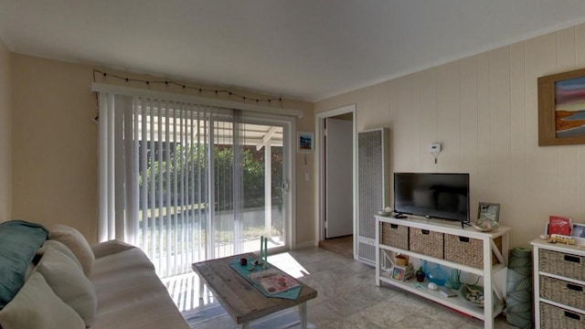 living room featuring a wealth of natural light and light tile floors