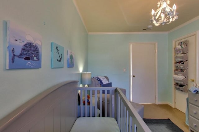 carpeted bedroom with crown molding, a nursery area, and a chandelier