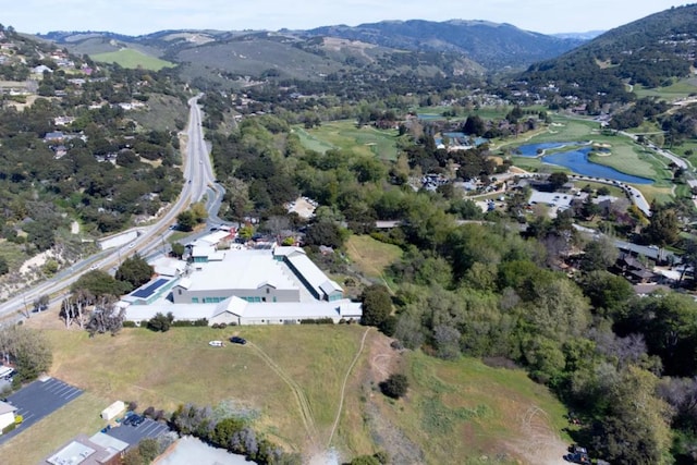 aerial view featuring a water and mountain view