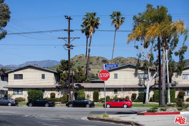 view of building exterior with a mountain view