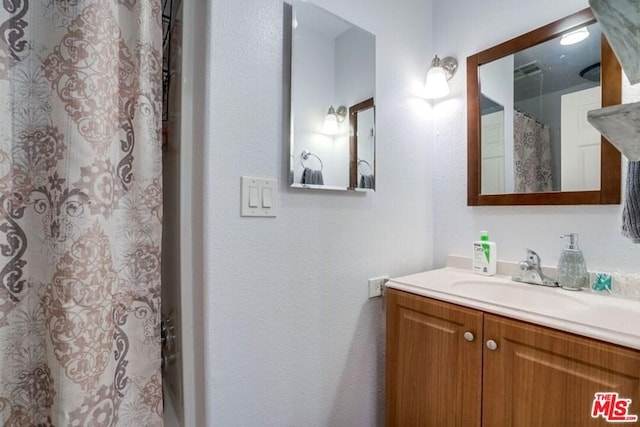 bathroom with vanity with extensive cabinet space