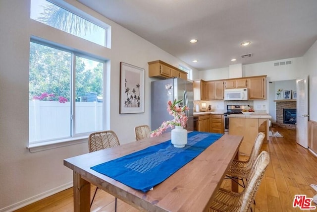 dining area with light wood-type flooring