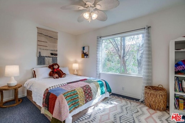 carpeted bedroom featuring ceiling fan