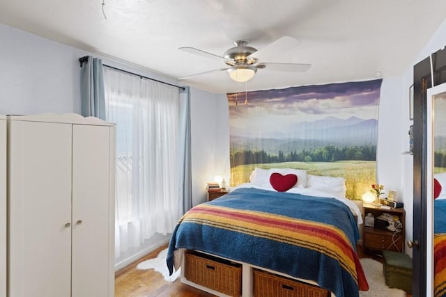 bedroom with a closet, ceiling fan, and light wood-type flooring