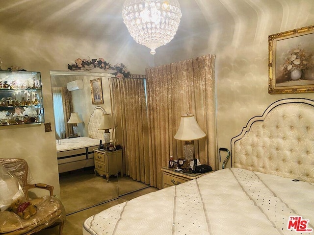 carpeted bedroom with a closet and a notable chandelier