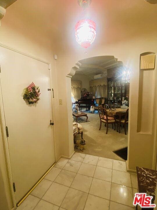 corridor with light tile flooring