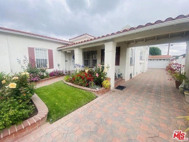 mediterranean / spanish home with a garage