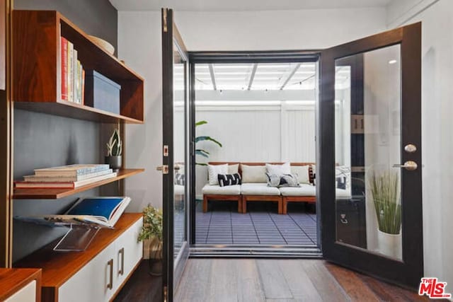 doorway to outside featuring dark hardwood / wood-style floors and french doors