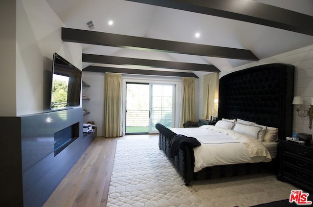 bedroom featuring access to outside, vaulted ceiling with beams, and light hardwood / wood-style floors