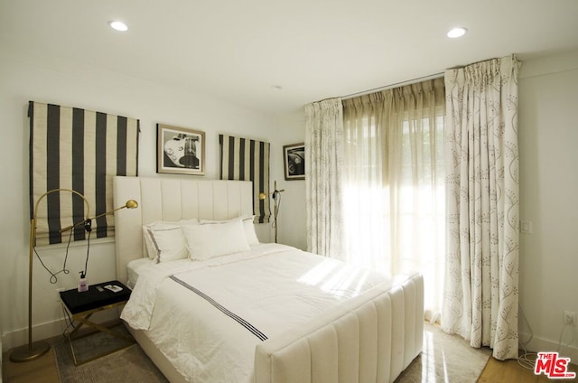 bedroom with wood-type flooring