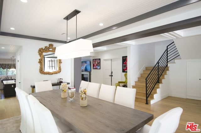 dining area featuring light wood-type flooring