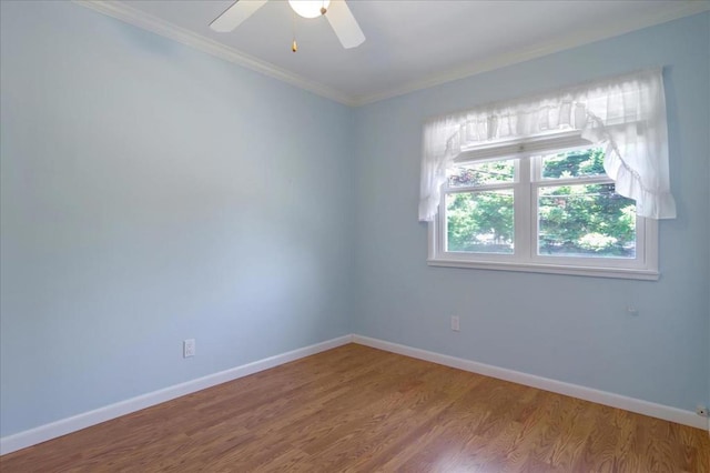 unfurnished room featuring ornamental molding, ceiling fan, and hardwood / wood-style flooring