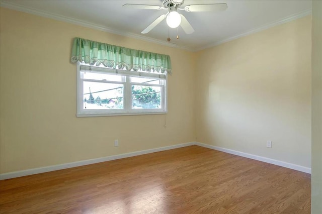 empty room featuring crown molding, ceiling fan, and hardwood / wood-style flooring