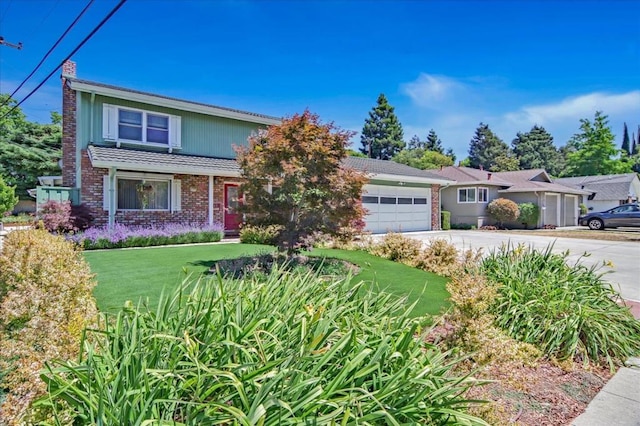 view of front of house featuring a front lawn and a garage