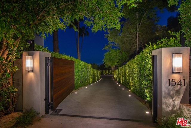 view of gate at night