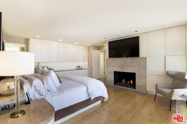 bedroom with light wood-type flooring