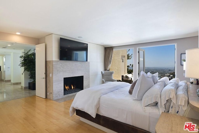 bedroom with light hardwood / wood-style flooring