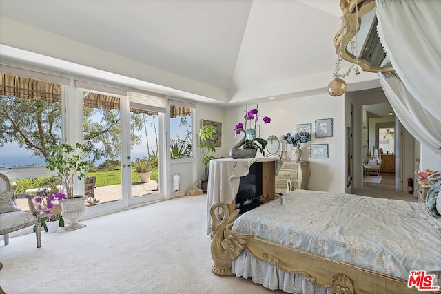 carpeted bedroom featuring access to outside and lofted ceiling