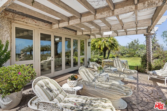 view of patio with french doors and a pergola