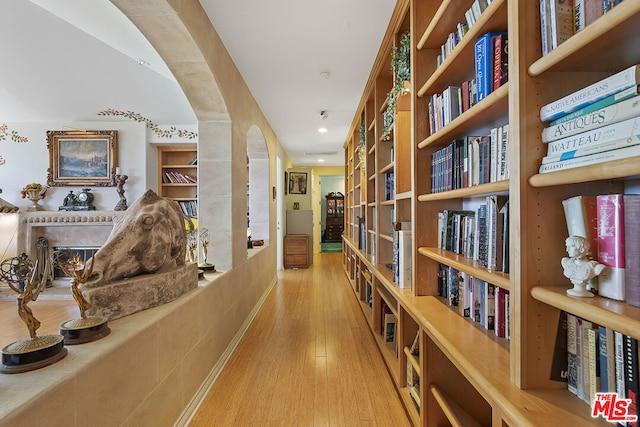 corridor with light wood-type flooring